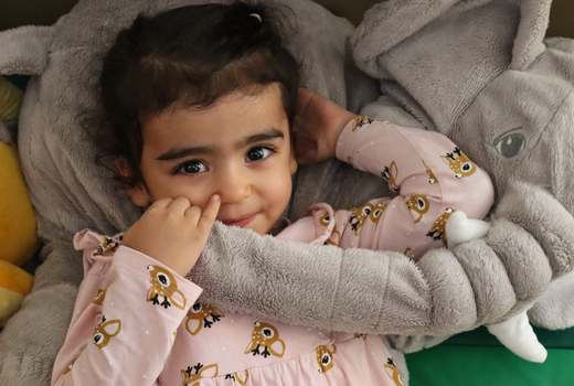 A child cared for in a safe, nurturing setting at American Lyceum Muscat